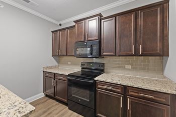 Kitchen with brown cabinets